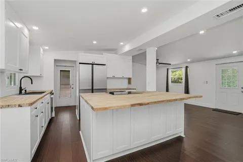 a view of room with wooden floor