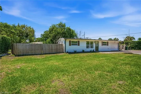 a view of a house with a back yard