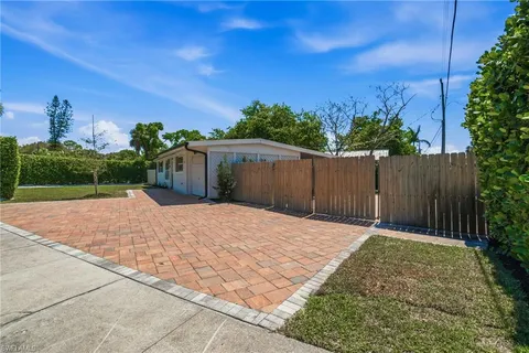 a view of a backyard with pathway