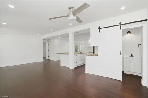 a kitchen with stainless steel appliances a stove refrigerator sink and cabinets