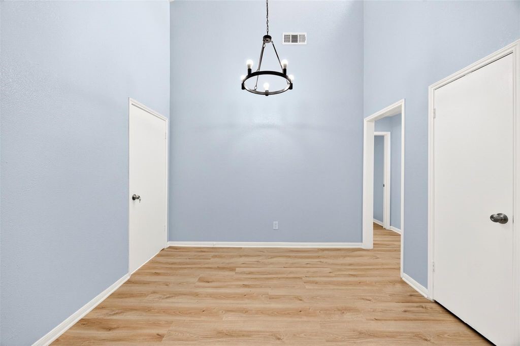 17 April Point Drive North Conroe, TX 77356 - Photo 36 of 42 a view of a room with wooden floor