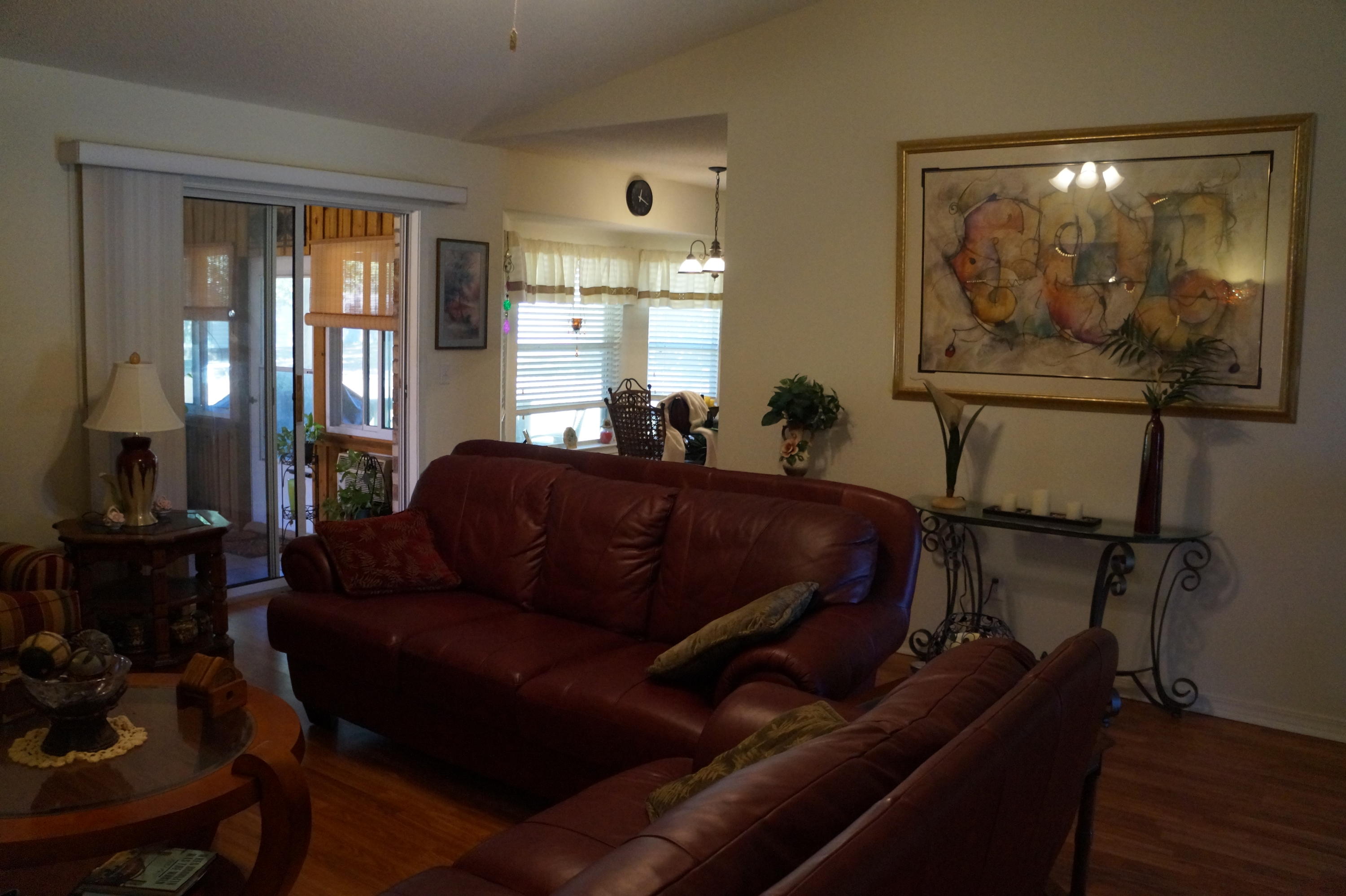 5534 Mulat Road Milton, FL 32583 - Photo 30 of 67 a living room with furniture and a flat screen tv