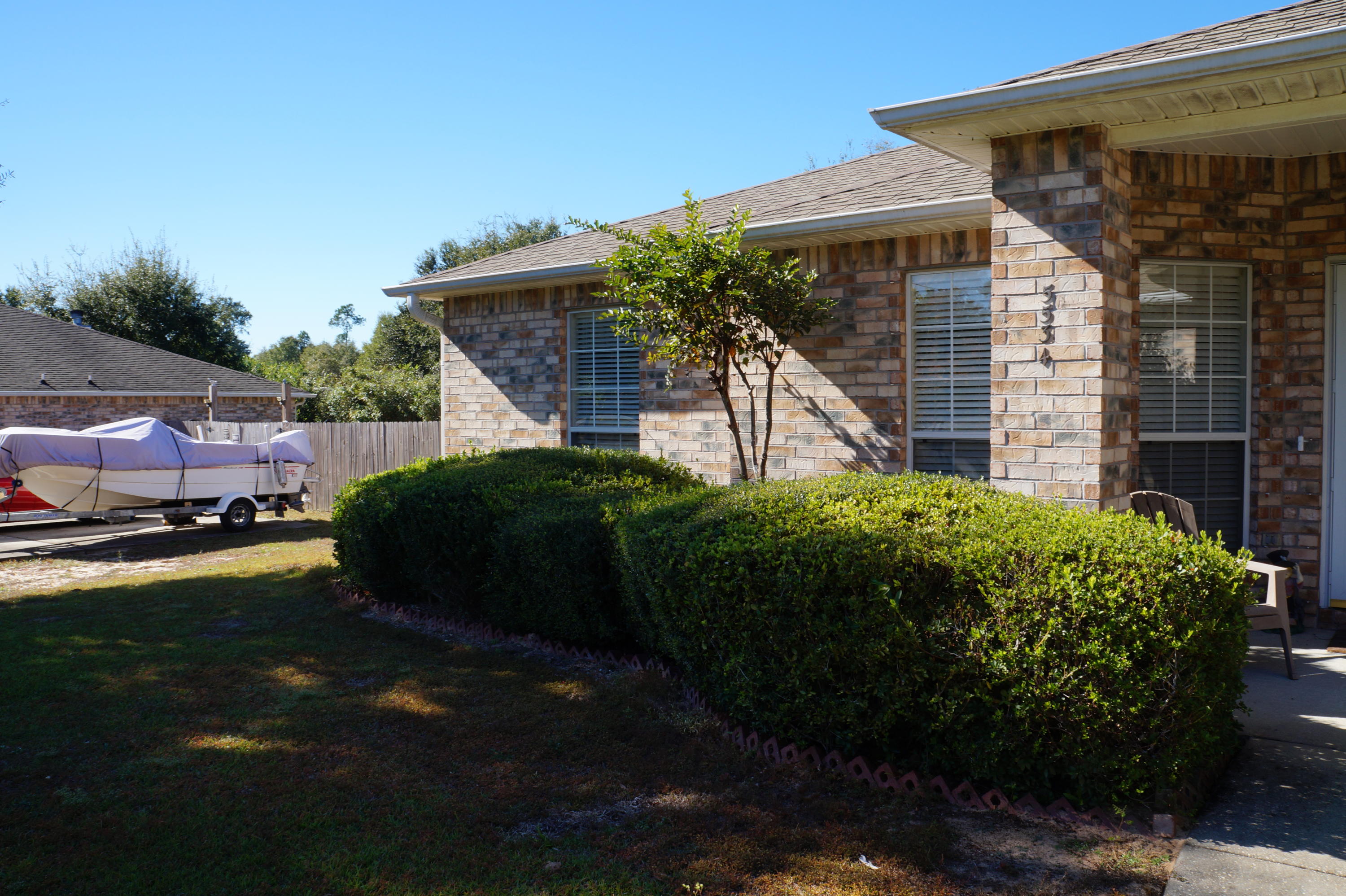 5534 Mulat Road Milton, FL 32583 - Photo 5 of 67 a front view of a house with a garden