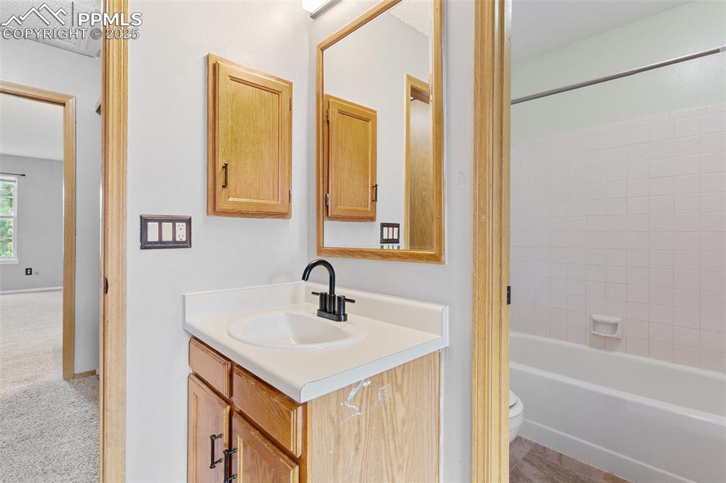 3457 Queen Anne Way Colorado Springs, CO 80917 - Photo 18 of 25 Full bath featuring vanity and tub / shower combination