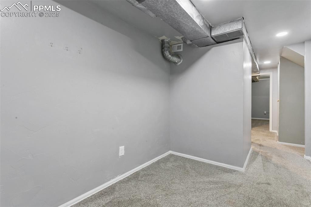 3457 Queen Anne Way Colorado Springs, CO 80917 - Photo 20 of 25 Finished below grade area featuring carpet and recessed lighting