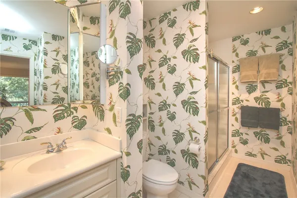 a bathroom with a sink and toilet