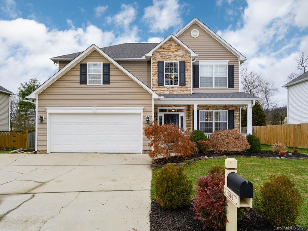 180 Wildbriar Road, Unit 12 Fletcher, NC 28732 - Photo 1 of 33 a front view of a house with a yard