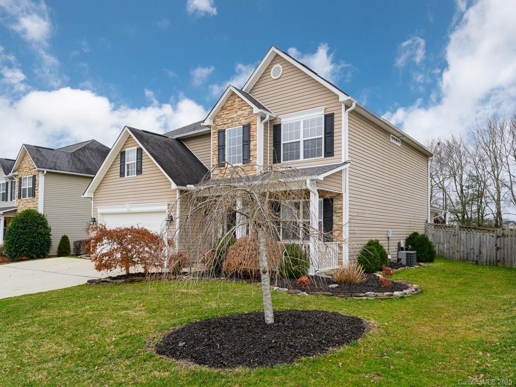 180 Wildbriar Road, Unit 12 Fletcher, NC 28732 - Photo 2 of 33 a front view of a house with garden