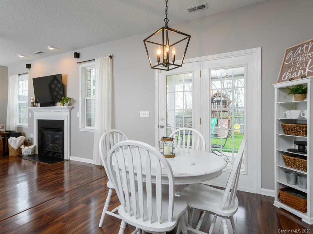 180 Wildbriar Road, Unit 12 Fletcher, NC 28732 - Photo 12 of 33 a view of a dining room with furniture window and wooden floor