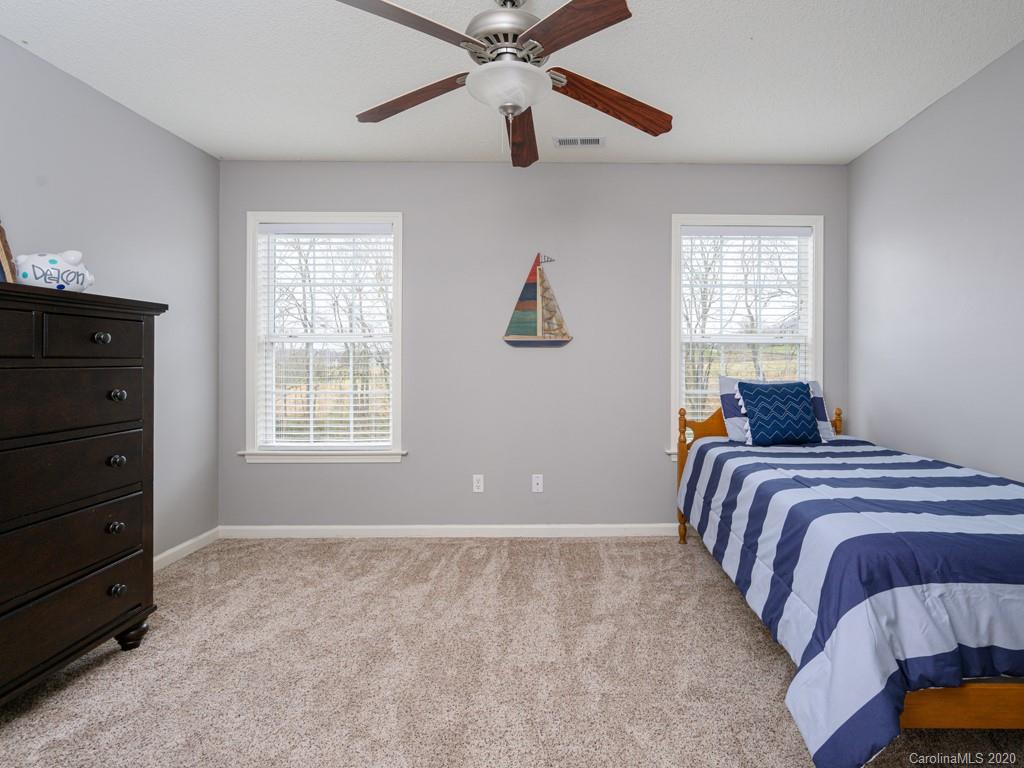 180 Wildbriar Road, Unit 12 Fletcher, NC 28732 - Photo 20 of 33 a bedroom with a bed and a window