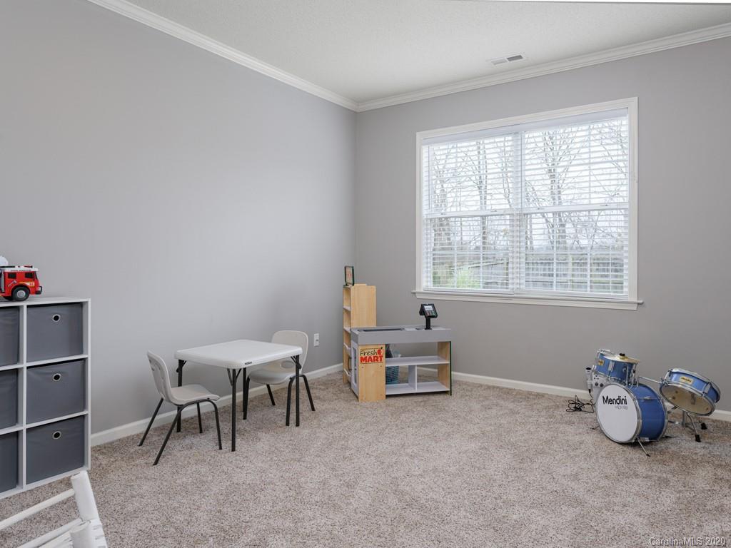 180 Wildbriar Road, Unit 12 Fletcher, NC 28732 - Photo 23 of 33 a room with furniture and a window