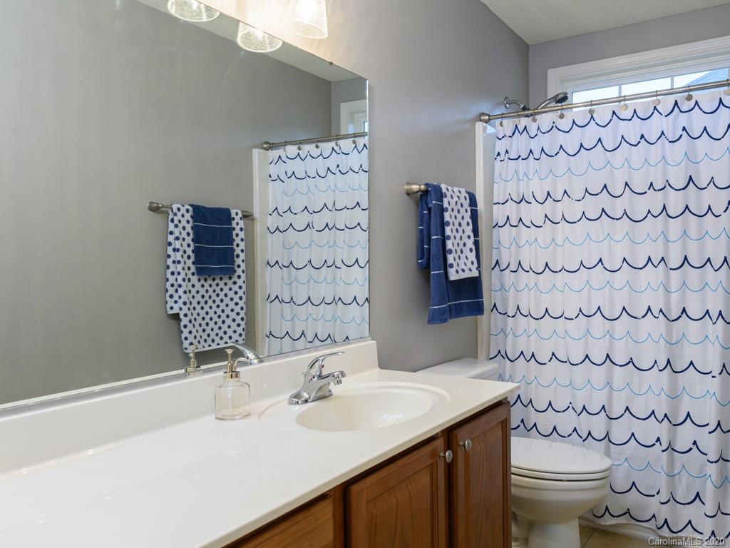 180 Wildbriar Road, Unit 12 Fletcher, NC 28732 - Photo 24 of 33 a bathroom with a sink toilet and shower