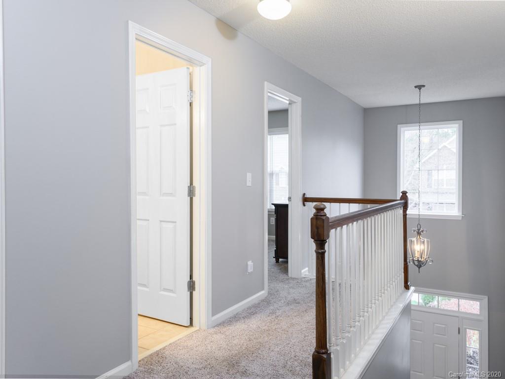 180 Wildbriar Road, Unit 12 Fletcher, NC 28732 - Photo 26 of 33 a view of a hallway with a window and a livingroom