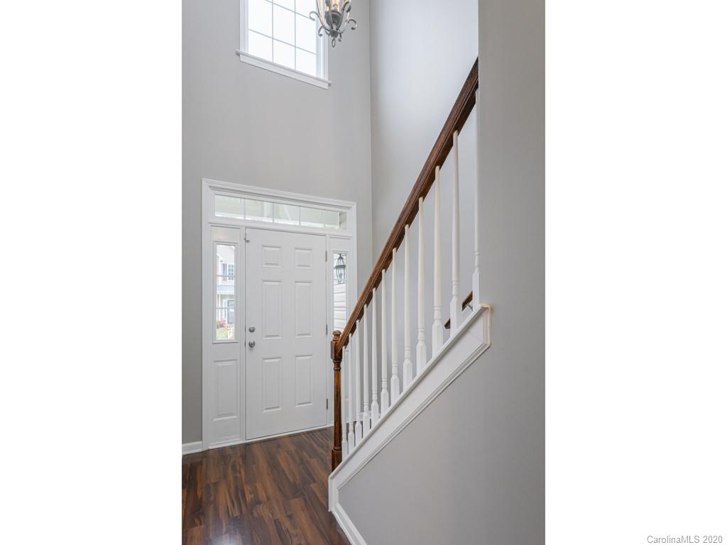 180 Wildbriar Road, Unit 12 Fletcher, NC 28732 - Photo 5 of 33 a view of a hallway with wooden floor and staircase