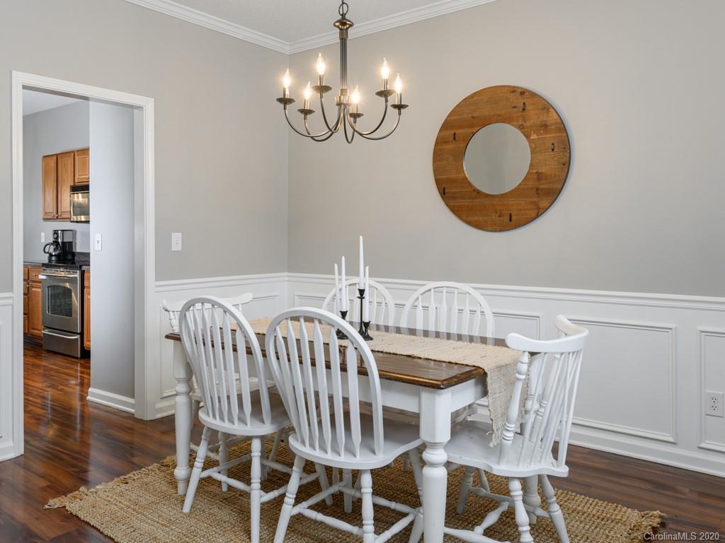 180 Wildbriar Road, Unit 12 Fletcher, NC 28732 - Photo 6 of 33 a view of a dining room with furniture and wooden floor