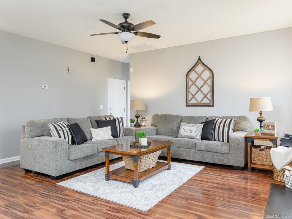 180 Wildbriar Road, Unit 12 Fletcher, NC 28732 - Photo 8 of 33 a living room with furniture and a wooden floor