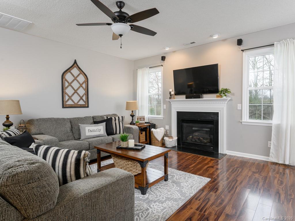 180 Wildbriar Road, Unit 12 Fletcher, NC 28732 - Photo 9 of 33 a living room with furniture a flat screen tv and a fireplace