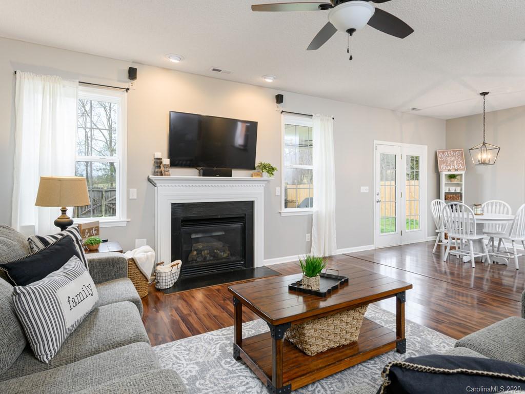 180 Wildbriar Road, Unit 12 Fletcher, NC 28732 - Photo 10 of 33 a living room with furniture a flat screen tv and a fireplace