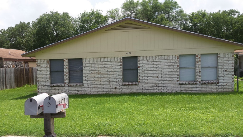4407 Teri Road Austin, TX 78744 - Photo 1 of 1 a front view of a house with garden