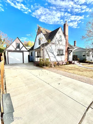 a view of a house with snow on the road