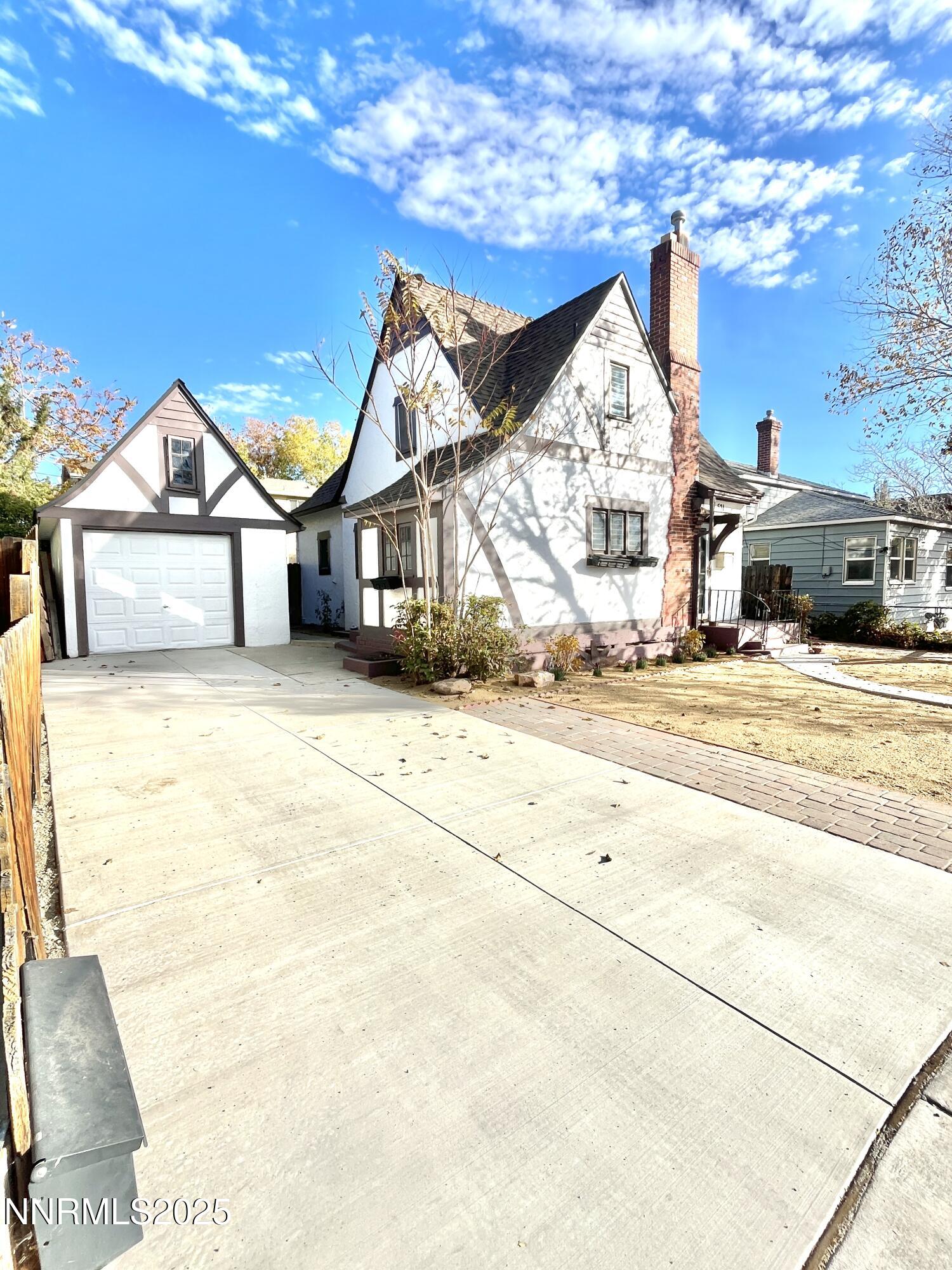 a view of a house with snow on the road