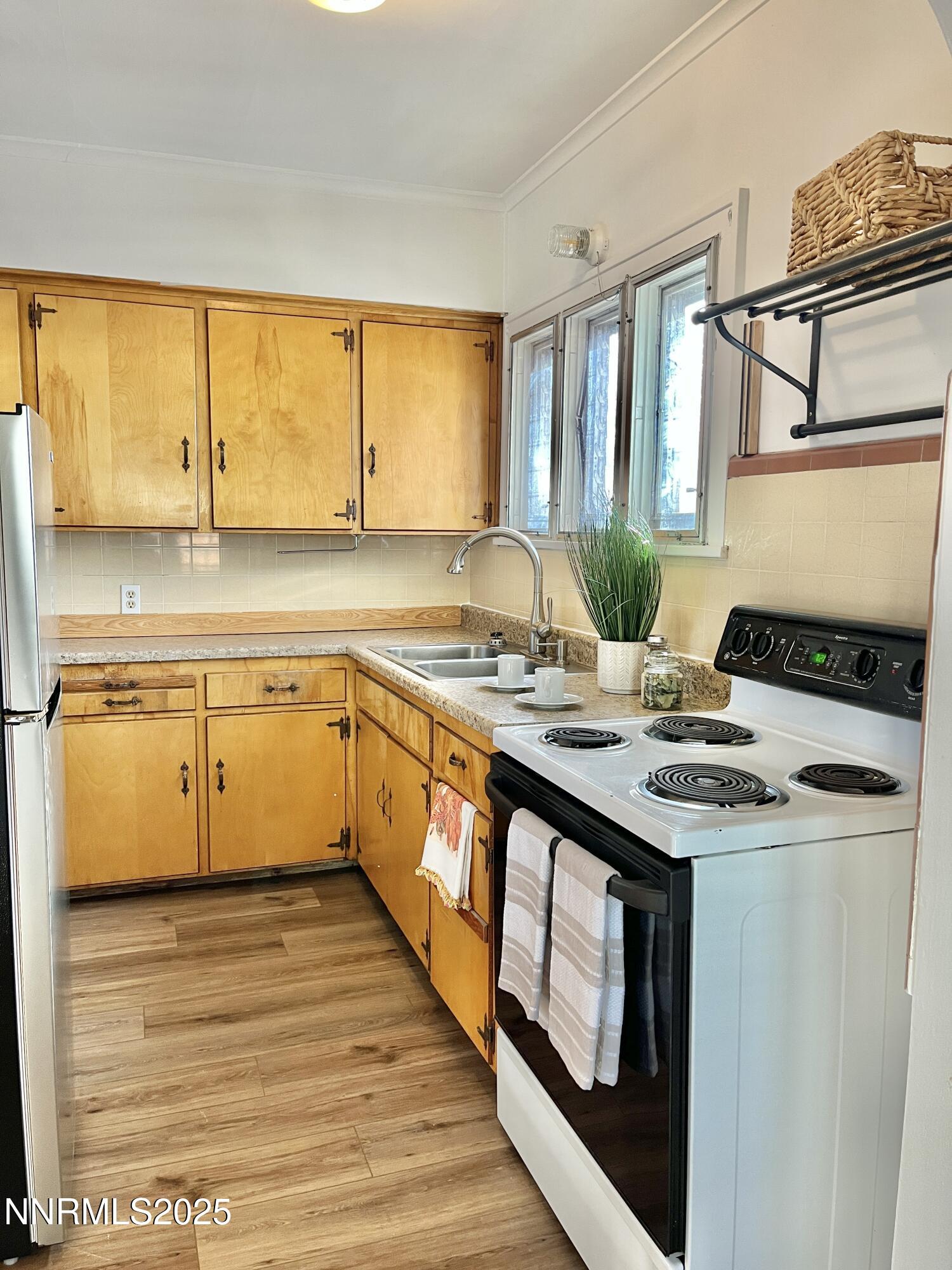531 East Taylor Street Reno, NV 89502 - Photo 5 of 15 a kitchen with a sink stove and cabinets