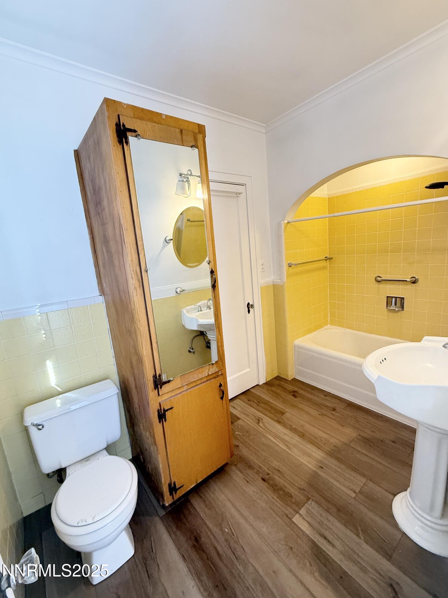 531 East Taylor Street Reno, NV 89502 - Photo 9 of 15 a bathroom with a toilet and a mirror