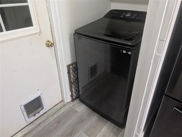 a view of an empty room and wooden floor