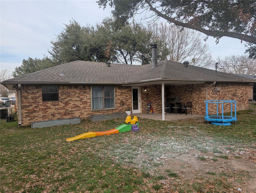 211 McAfee Street Mabank, TX 75147 - Photo 18 of 20 a view of a house with pool
