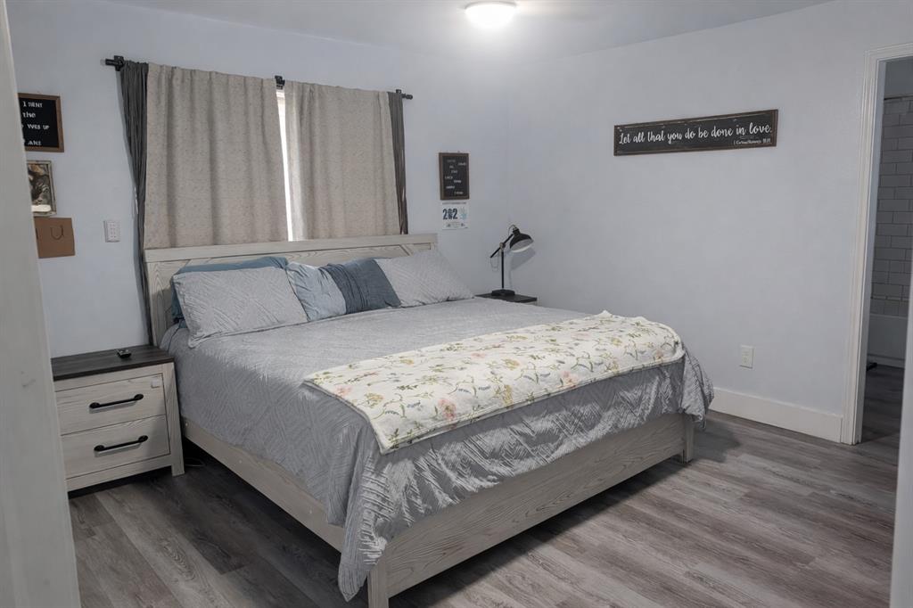 211 McAfee Street Mabank, TX 75147 - Photo 9 of 20 a bedroom with a bed and a window