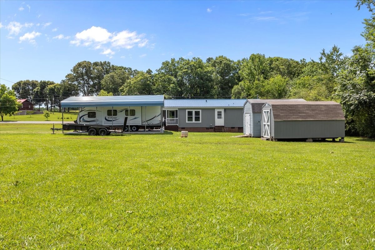 1112 Garners Creek Road Dickson, TN 37055 - Photo 43 of 57 a view of a house with swimming pool and yard