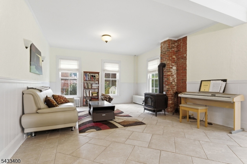 61 New Street Hampton, NJ 08827 - Photo 21 of 45 a living room with furniture and a fireplace