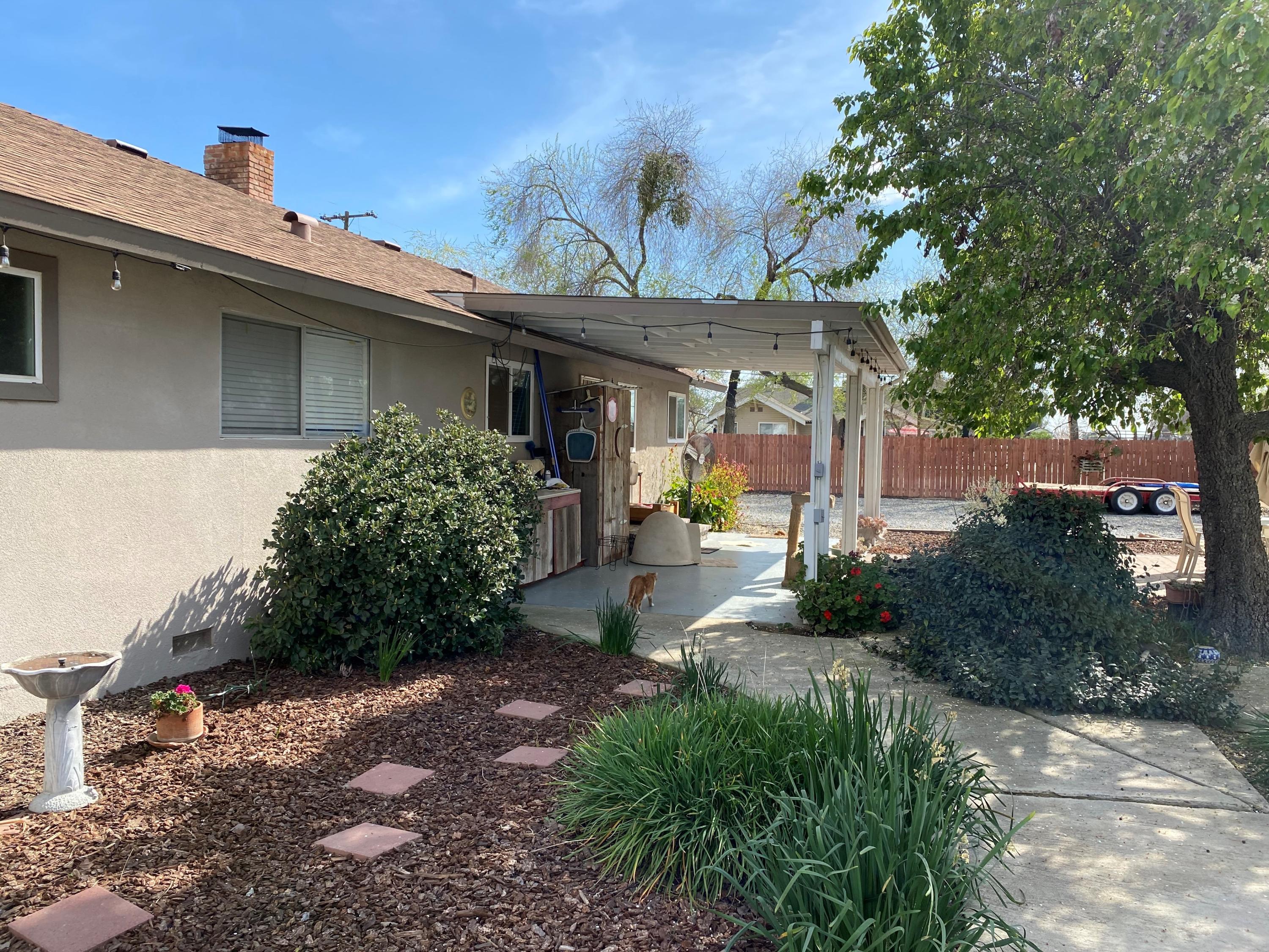 351 South Cornucopia Road Exeter, CA 93221 - Photo 16 of 22 a front view of a house with garden