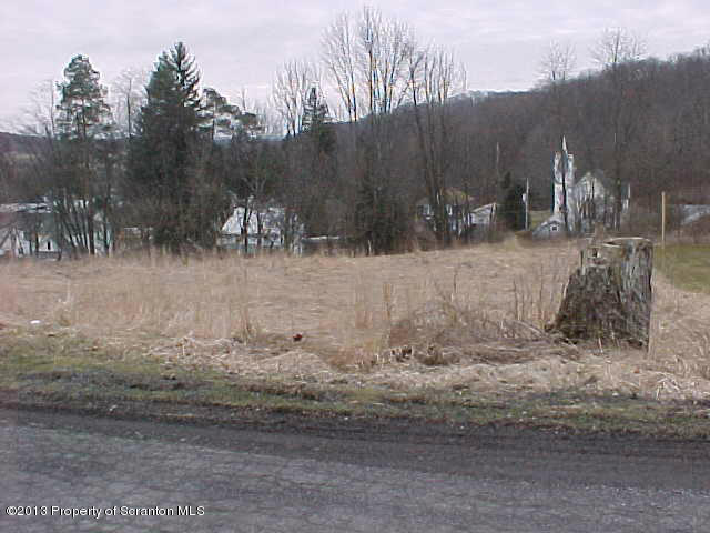 Academy Street Springville, PA 18844 - Photo 3 of 6 a view of a yard with wooden fence