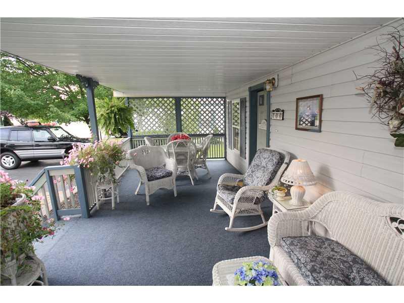 100 Reagan Road Mount Pleasant, PA 15666 - Photo 2 of 11 Patio/Deck. Large covered front porch.