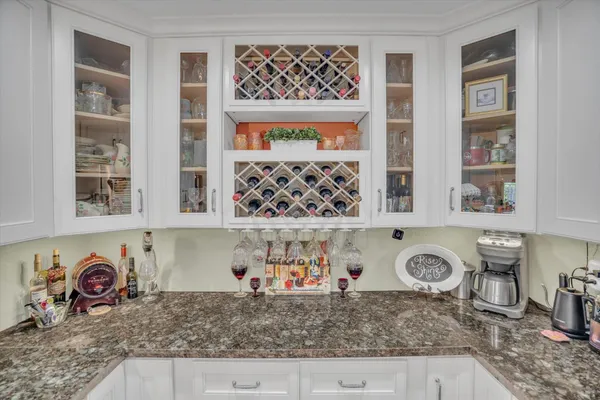 a kitchen with stainless steel appliances granite countertop a stove a sink and a counter space