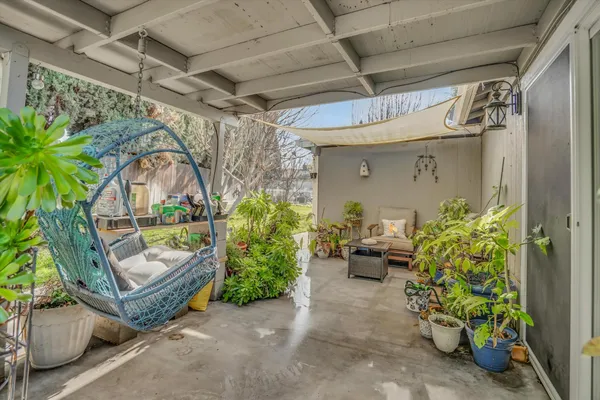 a living room filled with furniture and a table