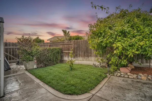 a view of a backyard with chairs