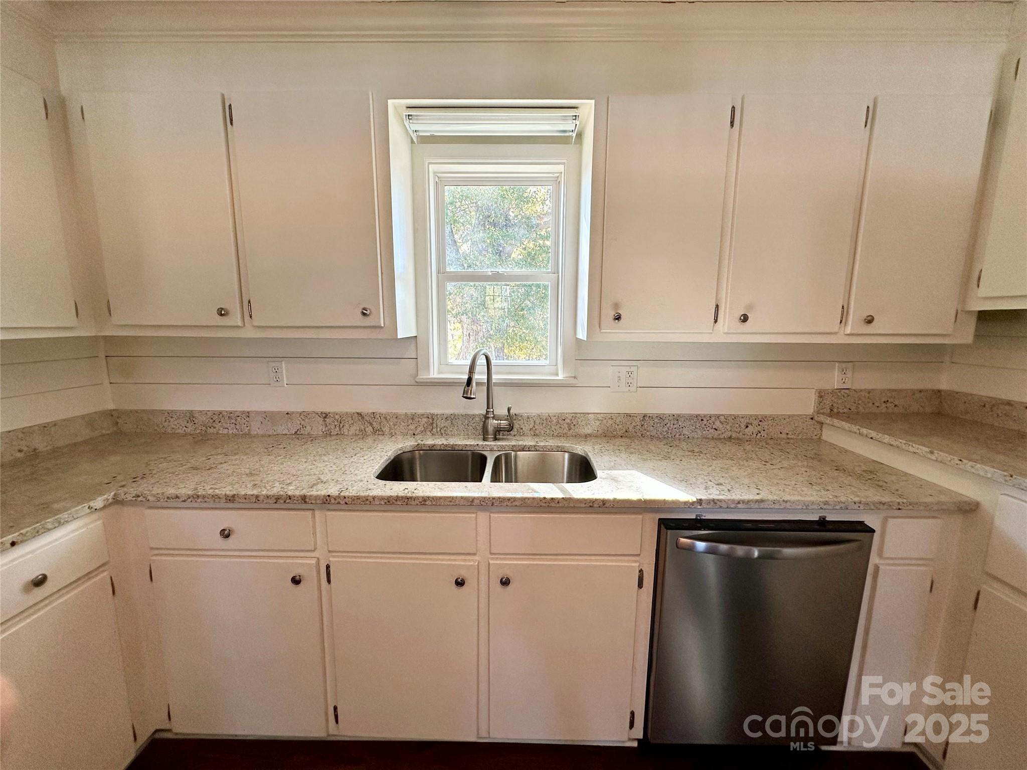1073 Jones Road Kershaw, SC 29067 - Photo 11 of 18 a kitchen with granite countertop white cabinets and a sink