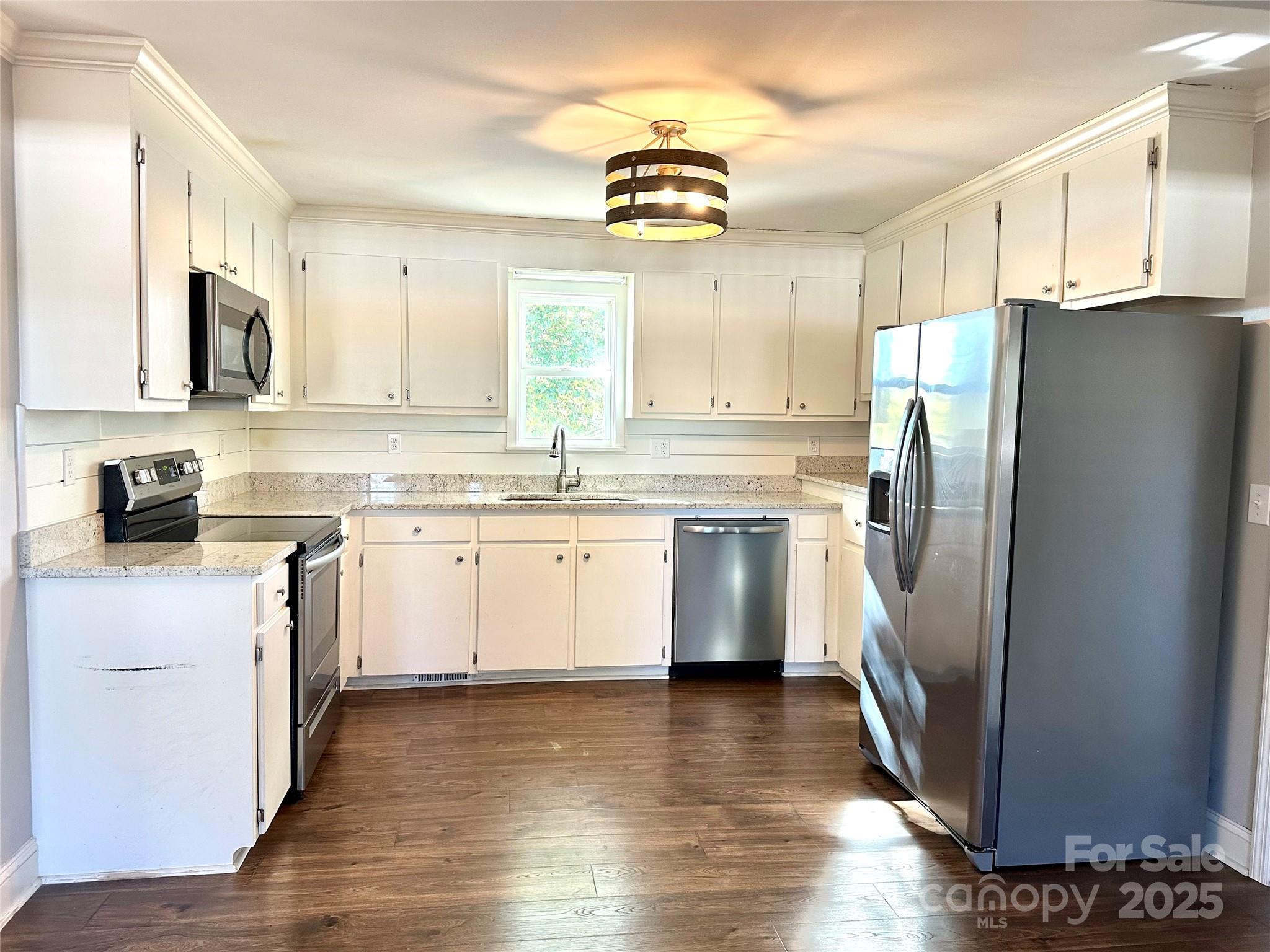 1073 Jones Road Kershaw, SC 29067 - Photo 8 of 18 a kitchen with stainless steel appliances a refrigerator sink and cabinets