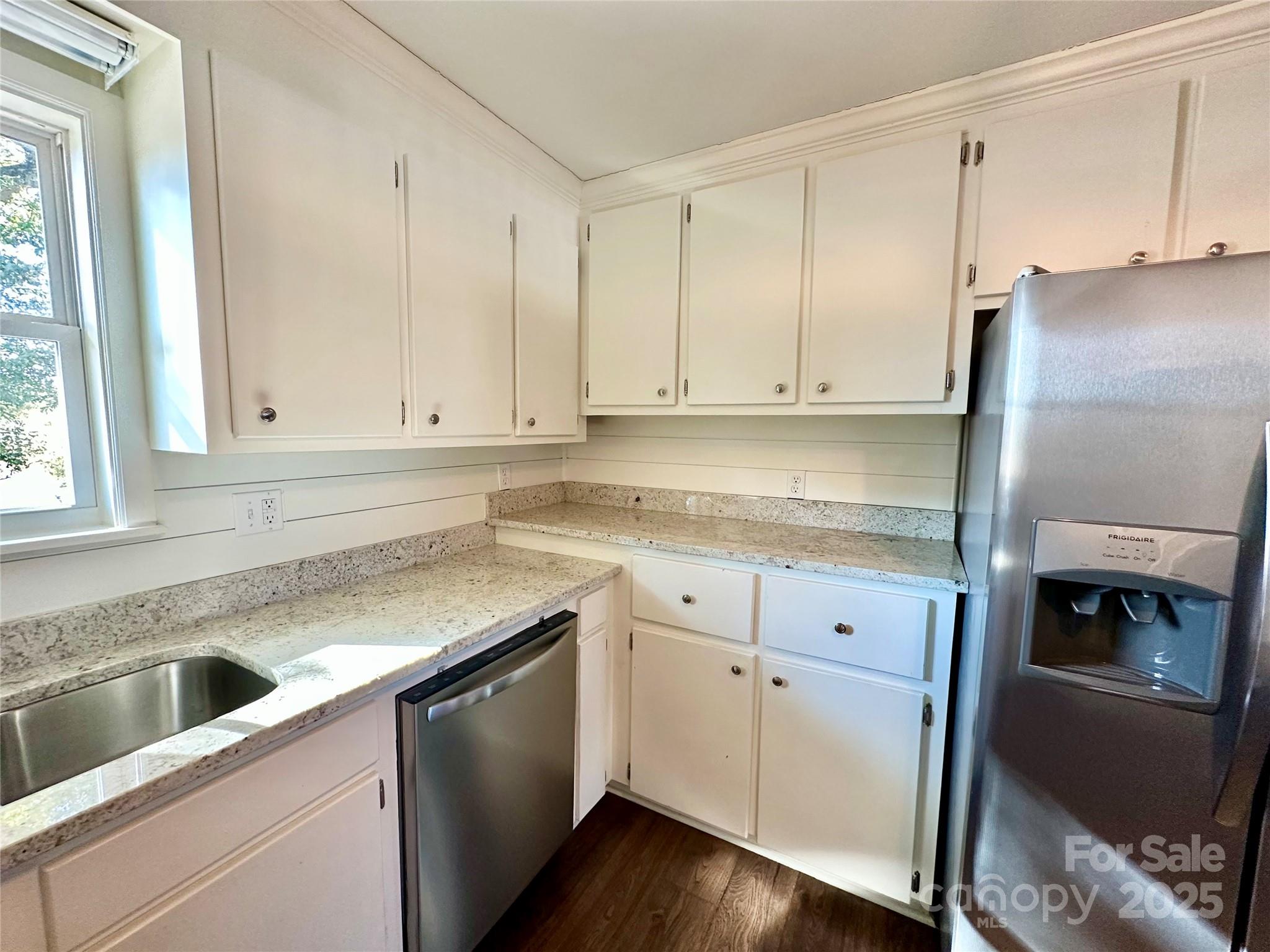 1073 Jones Road Kershaw, SC 29067 - Photo 10 of 18 a kitchen with granite countertop white cabinets and white appliances