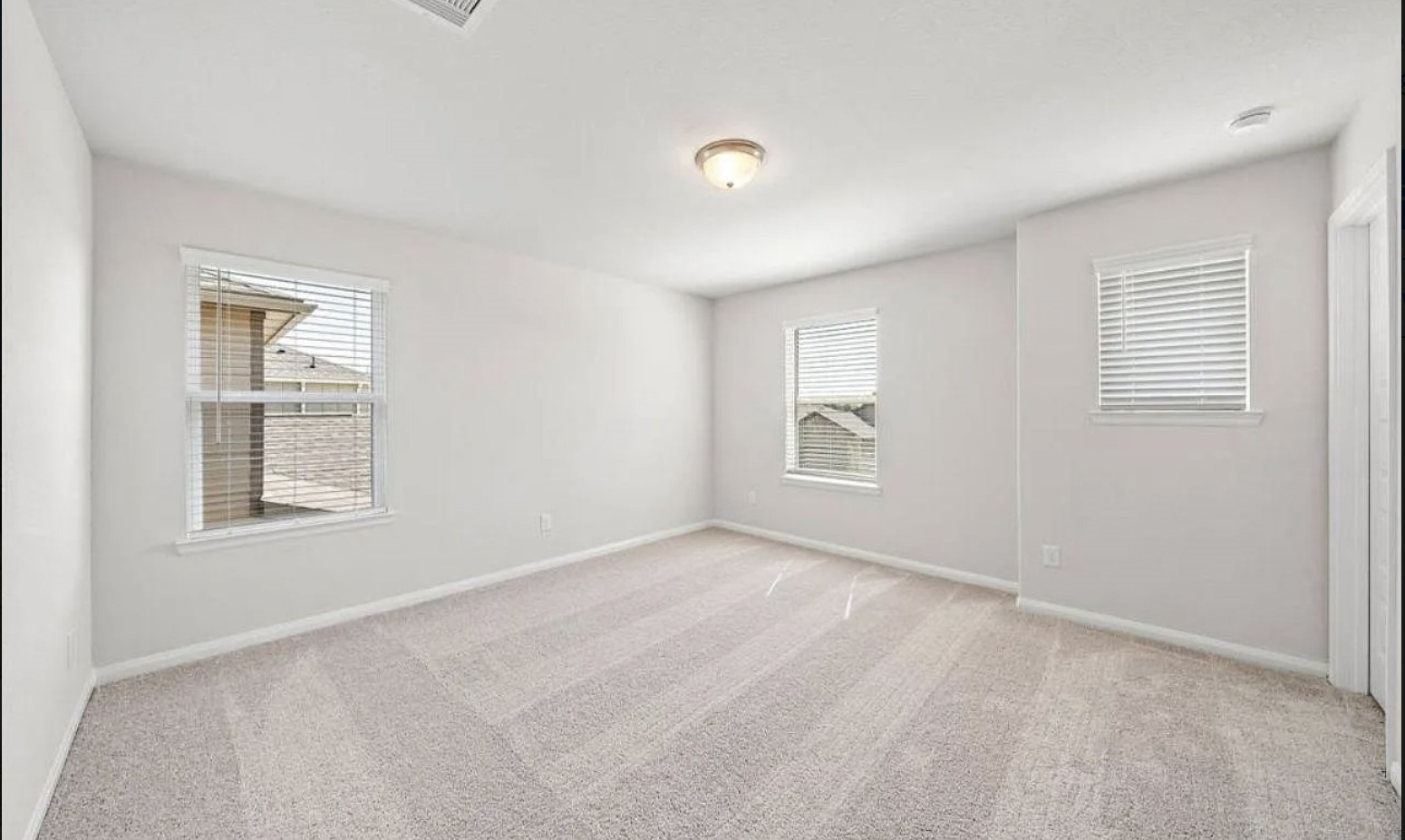 5631 Giving Grace Way Houston, TX 77048 - Photo 5 of 10 an empty room with windows