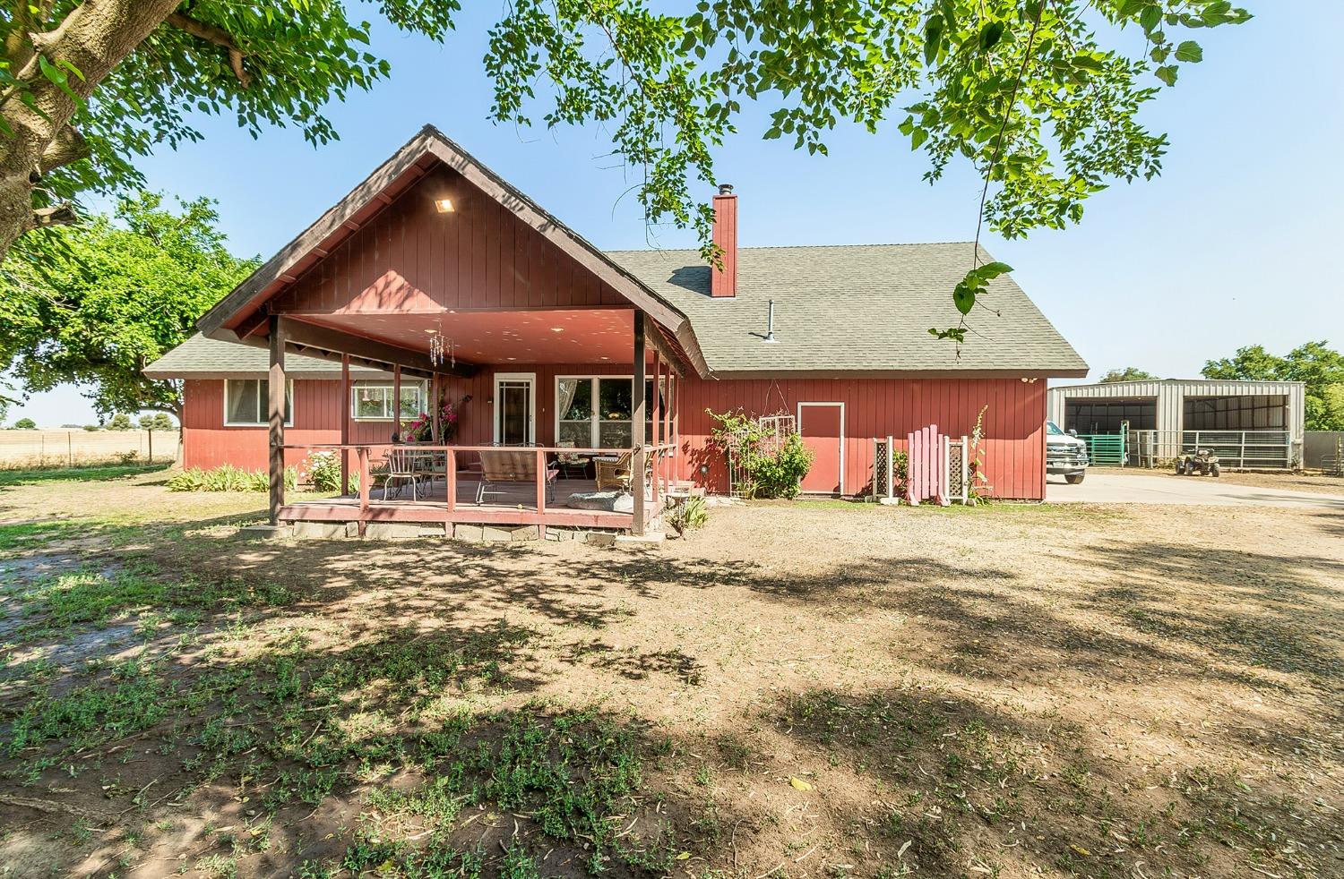 13016 Violet Lane Clovis, CA 93619 - Photo 2 of 41 a front view of a house with a garden