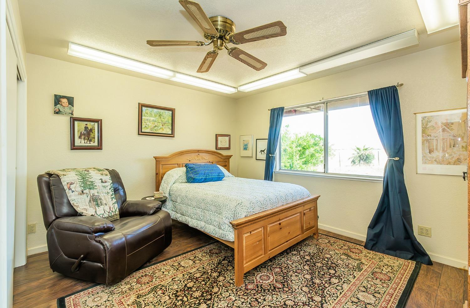 13016 Violet Lane Clovis, CA 93619 - Photo 24 of 41 a living room with furniture and a window