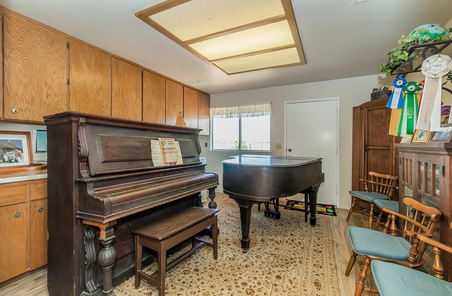 13016 Violet Lane Clovis, CA 93619 - Photo 26 of 41 a living room with furniture and a piano