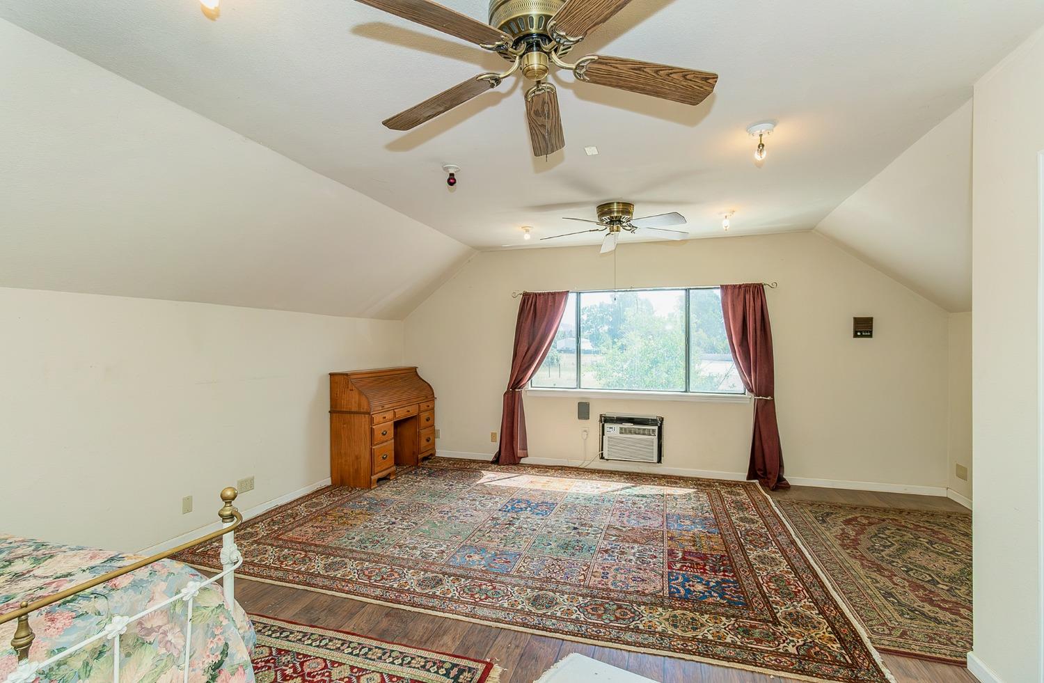 13016 Violet Lane Clovis, CA 93619 - Photo 27 of 41 a bedroom with a bed and a window