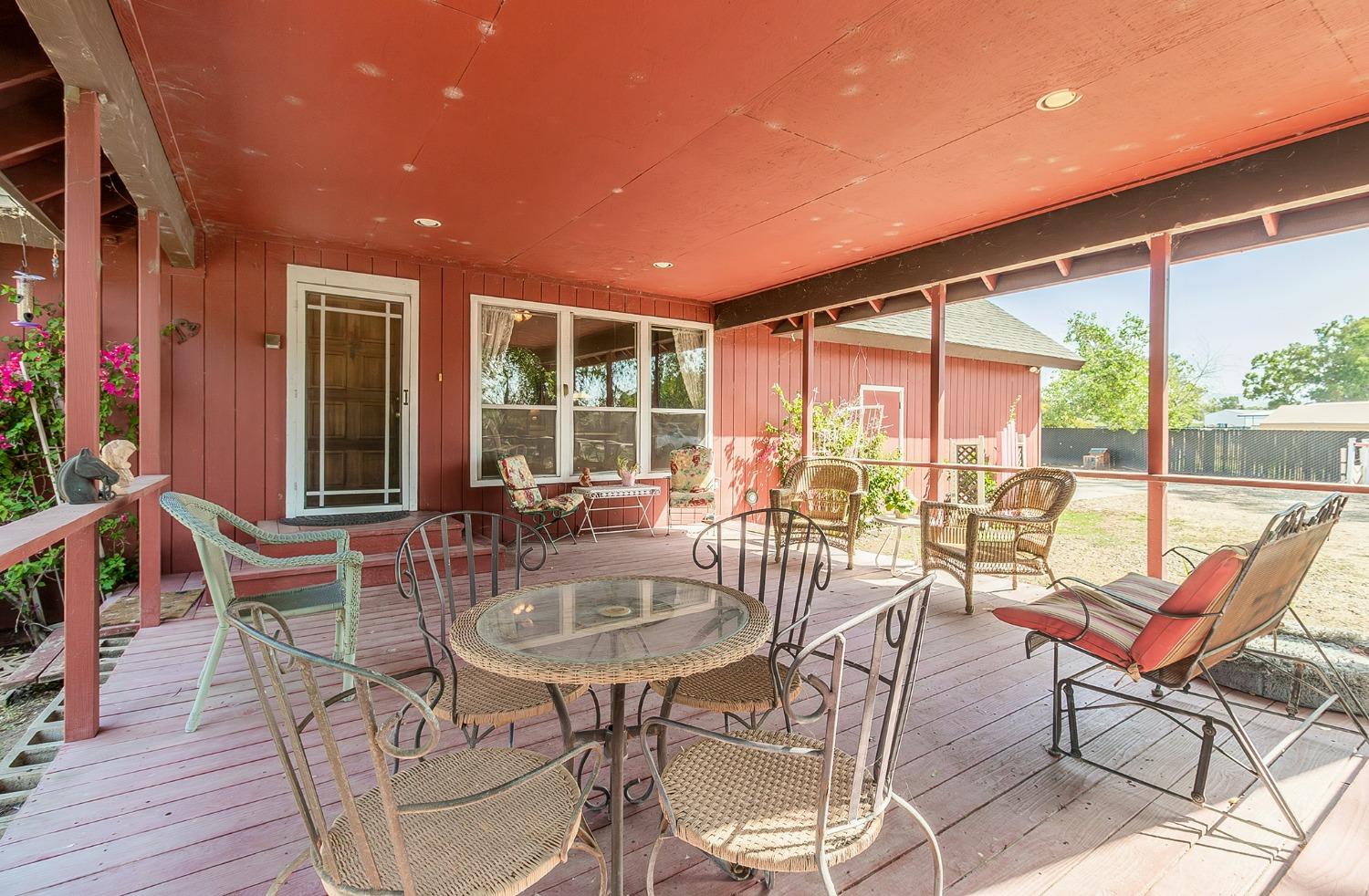 13016 Violet Lane Clovis, CA 93619 - Photo 4 of 41 a outdoor dining space with furniture and wooden floor