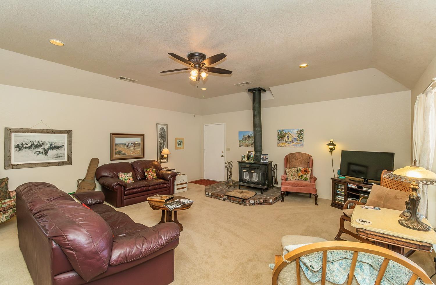 13016 Violet Lane Clovis, CA 93619 - Photo 6 of 41 a living room with furniture
