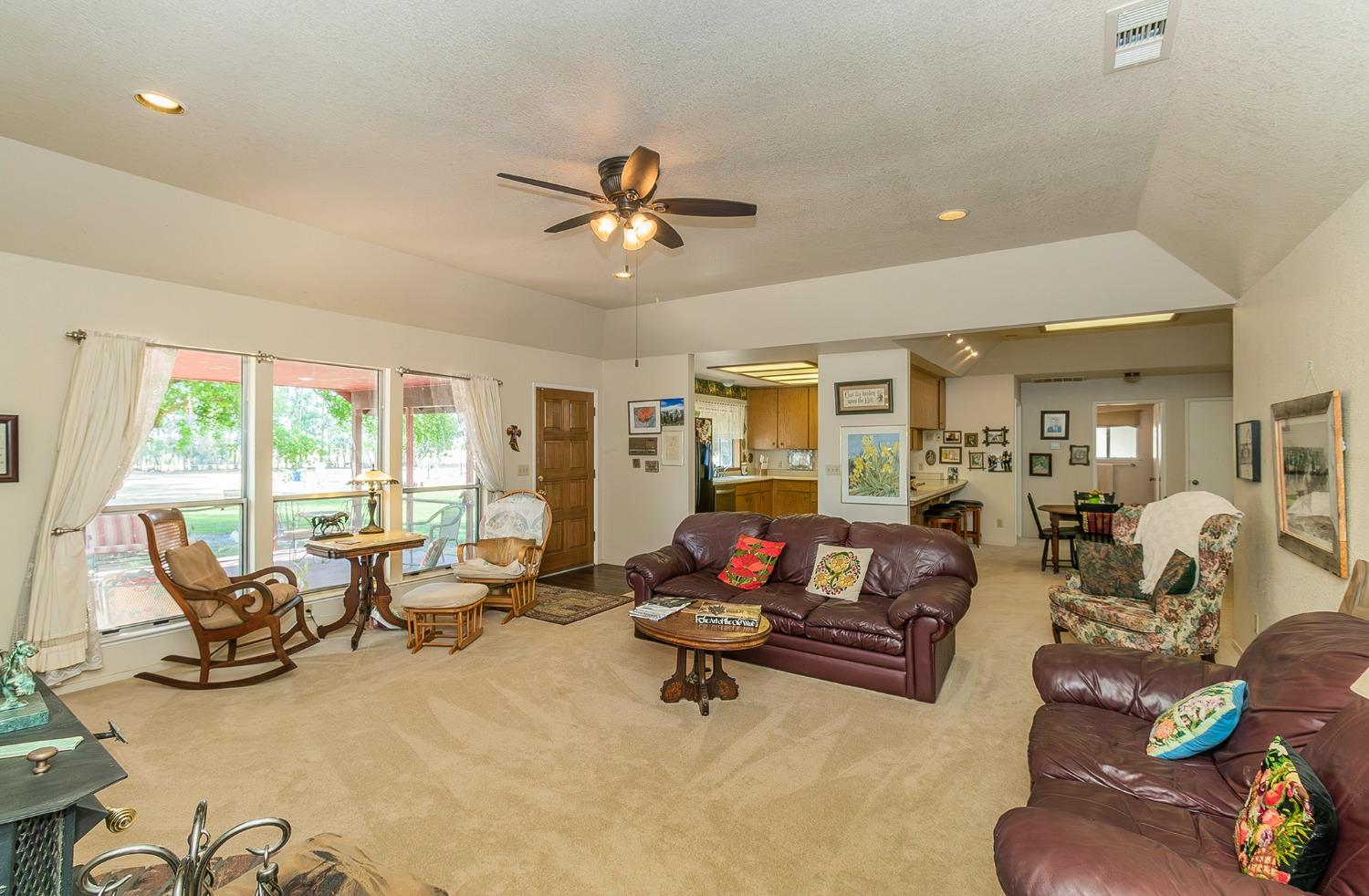 13016 Violet Lane Clovis, CA 93619 - Photo 8 of 41 a living room with furniture and floor to ceiling window