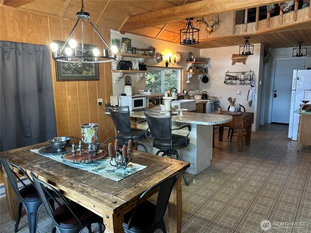 a view of a dining table and chairs in the patio